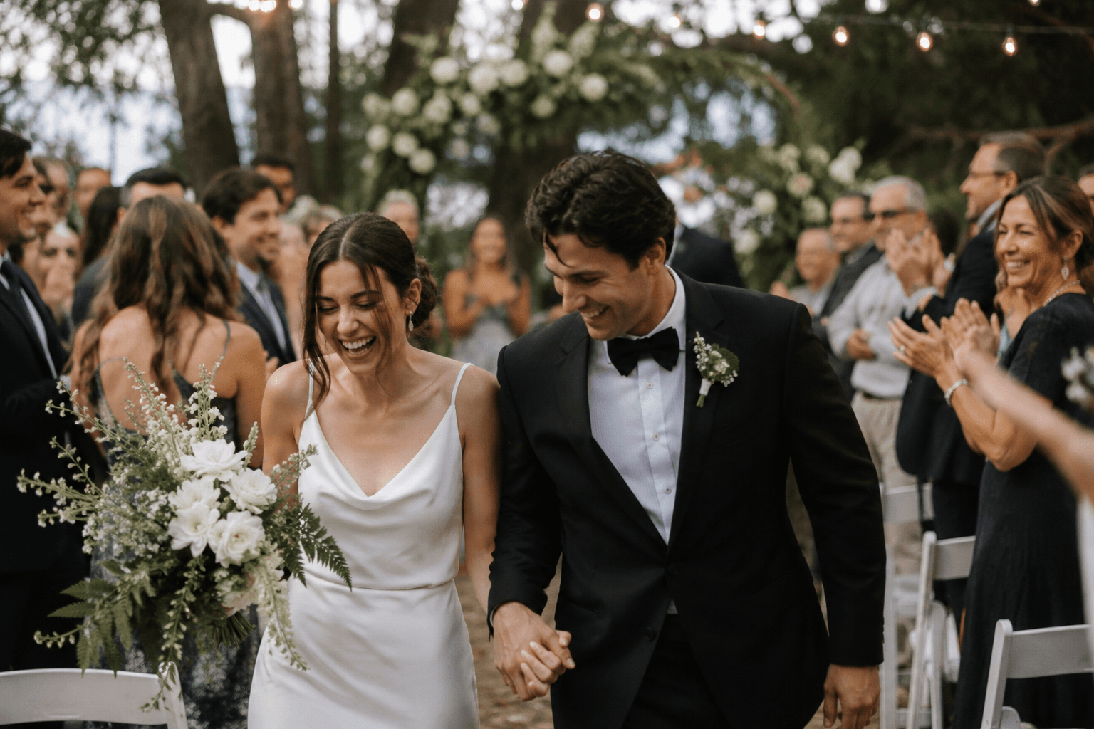 Couple celebrating at their outdoor wedding ceremony
